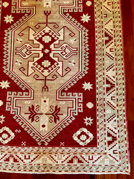 Dimensions: 4'8.5" x 7'2"  Palette includes ruby red, mint, pops of sky blue, ivory and tan.&nbsp;  Vintage Turkish rug from Anatolia, handmade of wool c.1970.&nbsp;
