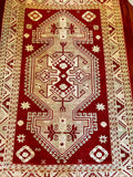 Dimensions: 4'8.5" x 7'2"  Palette includes ruby red, mint, pops of sky blue, ivory and tan.&nbsp;  Vintage Turkish rug from Anatolia, handmade of wool c.1970.&nbsp;